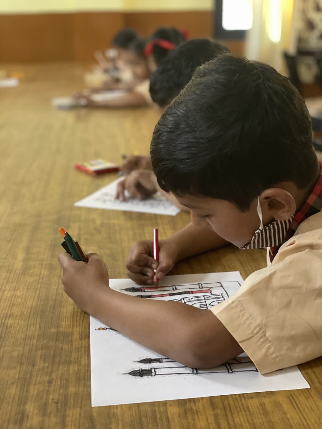 Students taking part in drawing activity on World Heritage Day